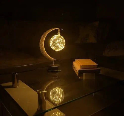Elegante stimmungsvolle LED-Tischlampe aus Glas in Mondform mit warmem Licht