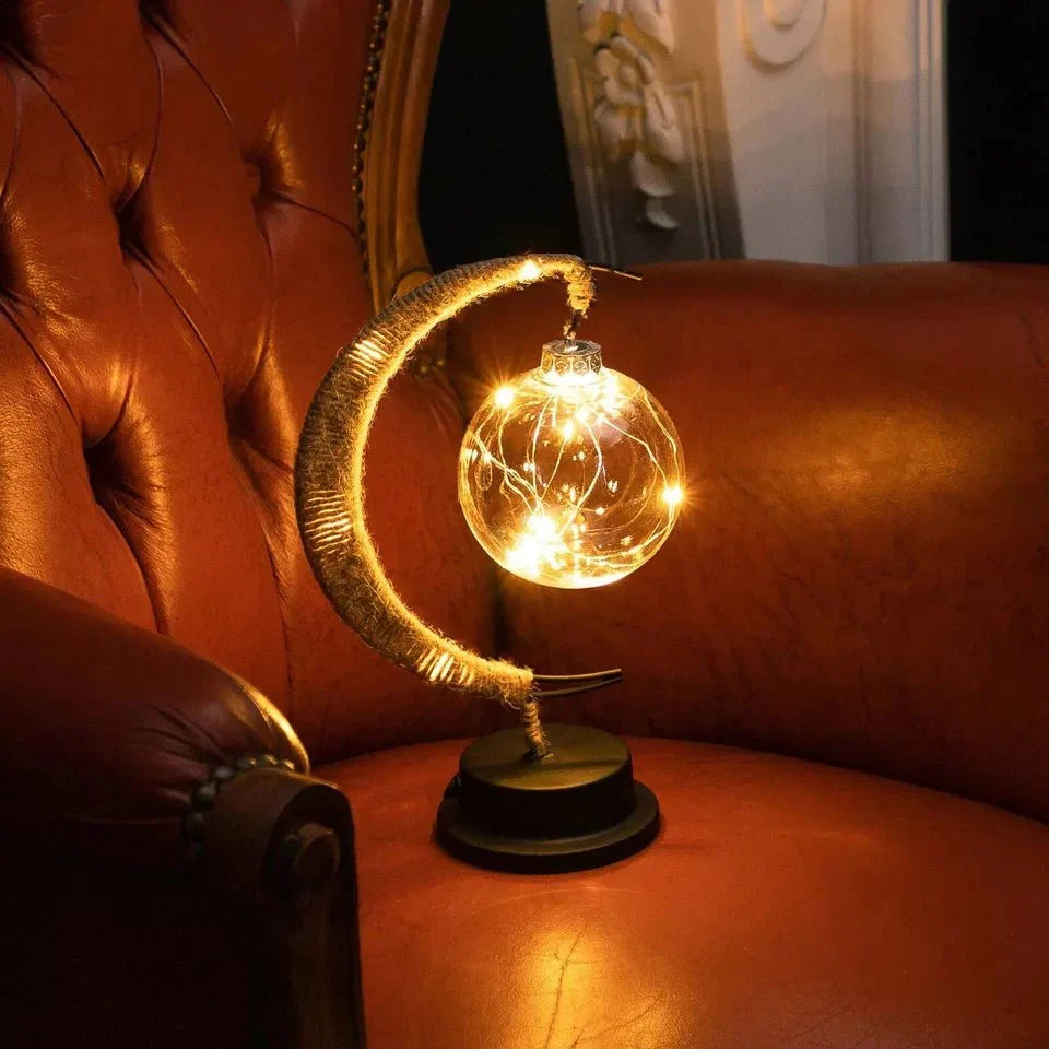 Elegante stimmungsvolle LED-Tischlampe aus Glas in Mondform mit warmem Licht
